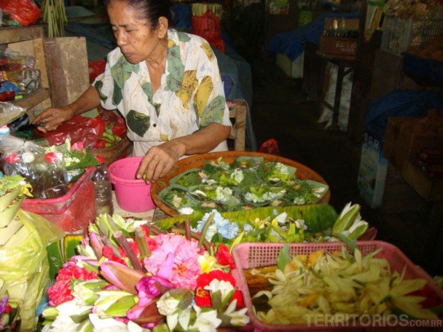 Preparing offerings at he public market of Denpasar
